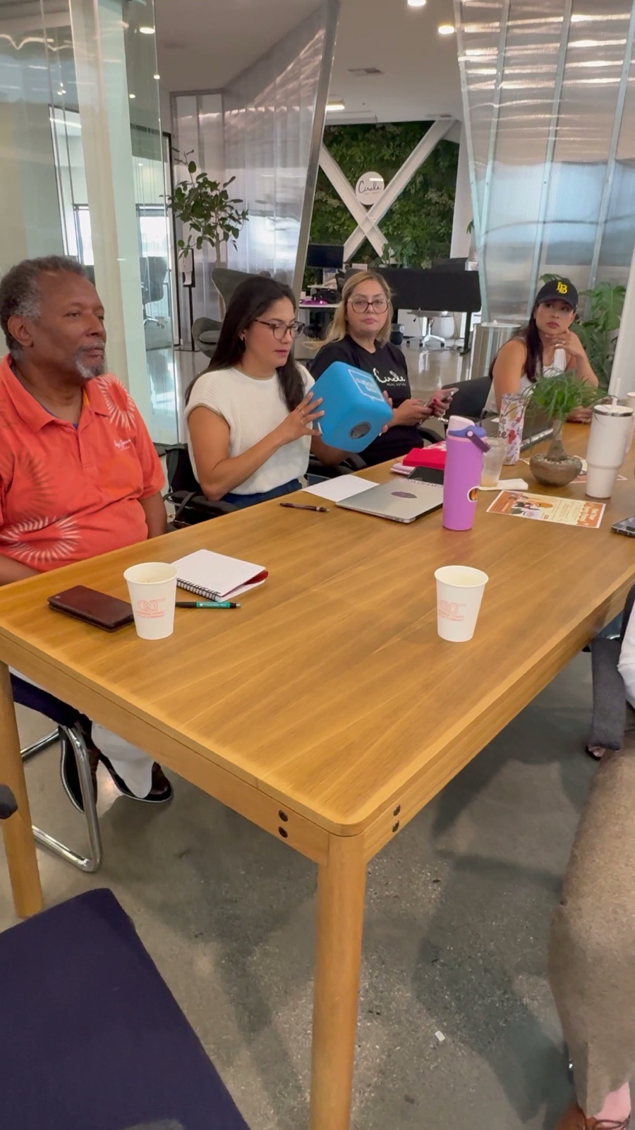 Circle agents gathered around a table in the office
